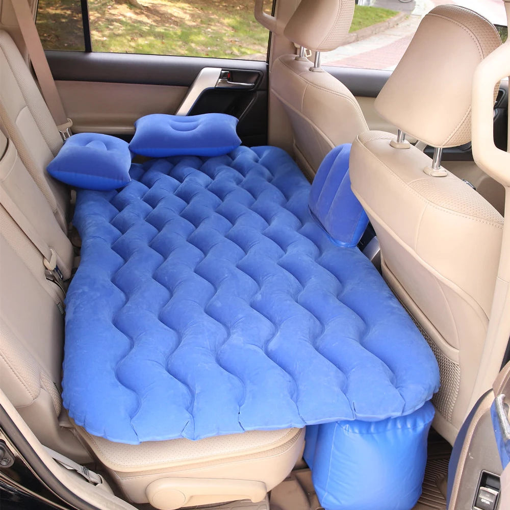 Blue inflatable air mattress in a car back seat