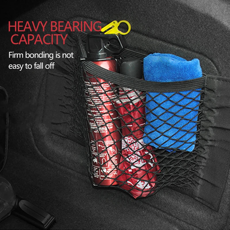 Mesh net holding bottles and a towel