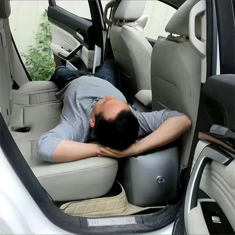 Man resting in the back seat with the gap filler inflated