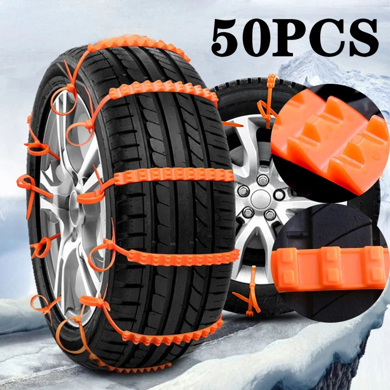 Orange nylon snow chain ties on a car tire in the snow