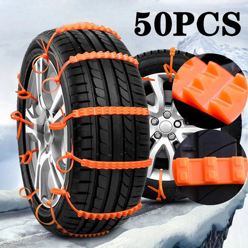 Orange nylon snow chain ties on a car tire in the snow