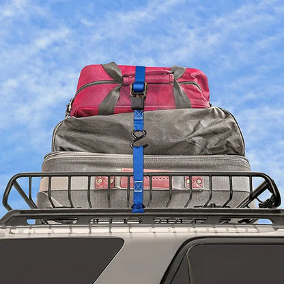 Luggage on a roof rack secured with straps