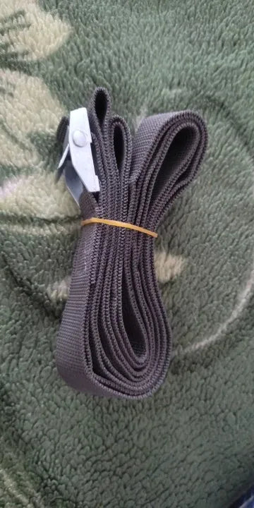 Bundle of dark tie-down straps