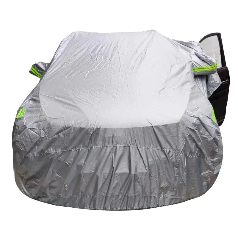 Two-tone silver car cover with reflective strips on an SUV, front view