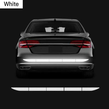 White reflective strip on the rear bumper of a car