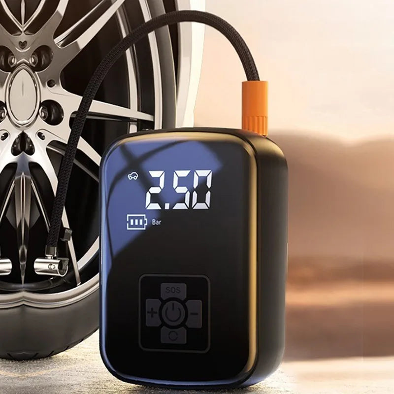 Tire inflator next to a car wheel, display showing 2.50 bar