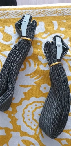 Black tie-down straps coiled