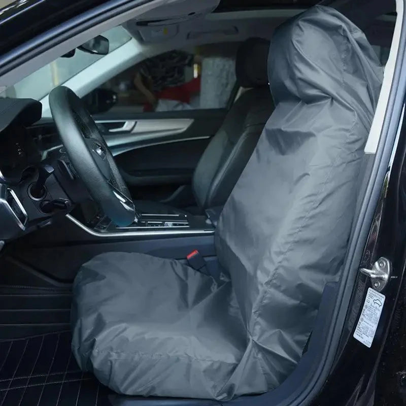Black waterproof seat protector on a front car seat