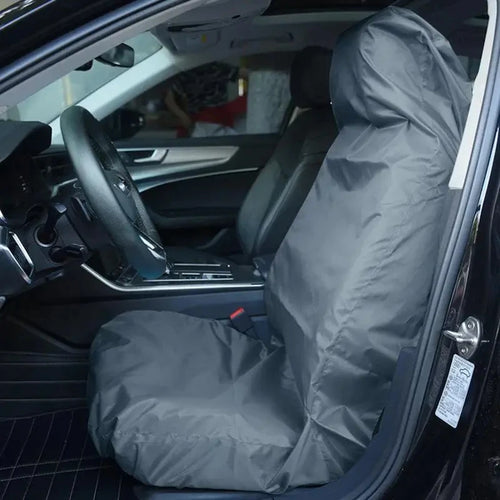 Black waterproof seat protector on a front car seat
