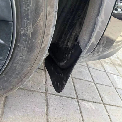 Installed mud flap behind the front wheel