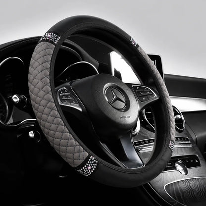 Gray perforated steering wheel cover