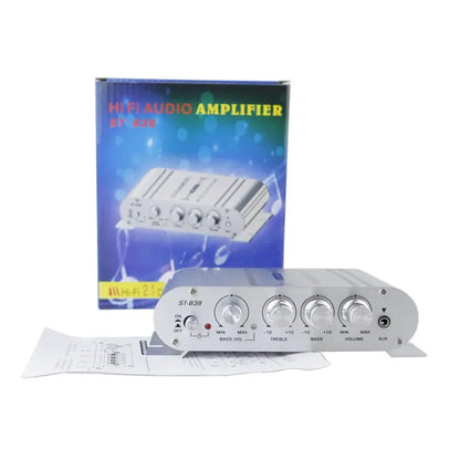 Silver version of the mini amplifier in front of its box