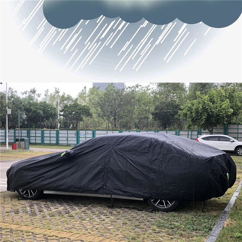 Black car cover on a car in the rain