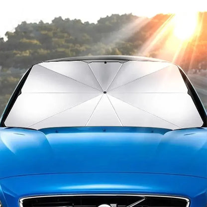 Silver umbrella sun shade seen through the windshield from outside the car