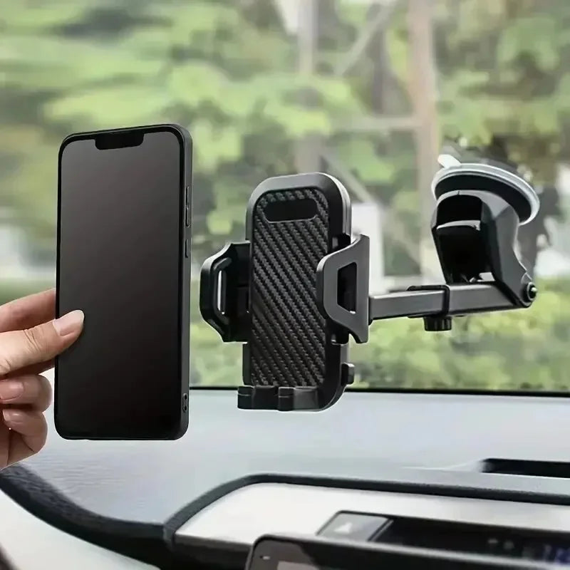 Suction cup car phone mount on a dashboard holding a smartphone