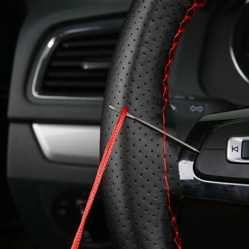 Stitching the cover onto the steering wheel