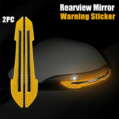 Yellow reflective strips on a car side mirror