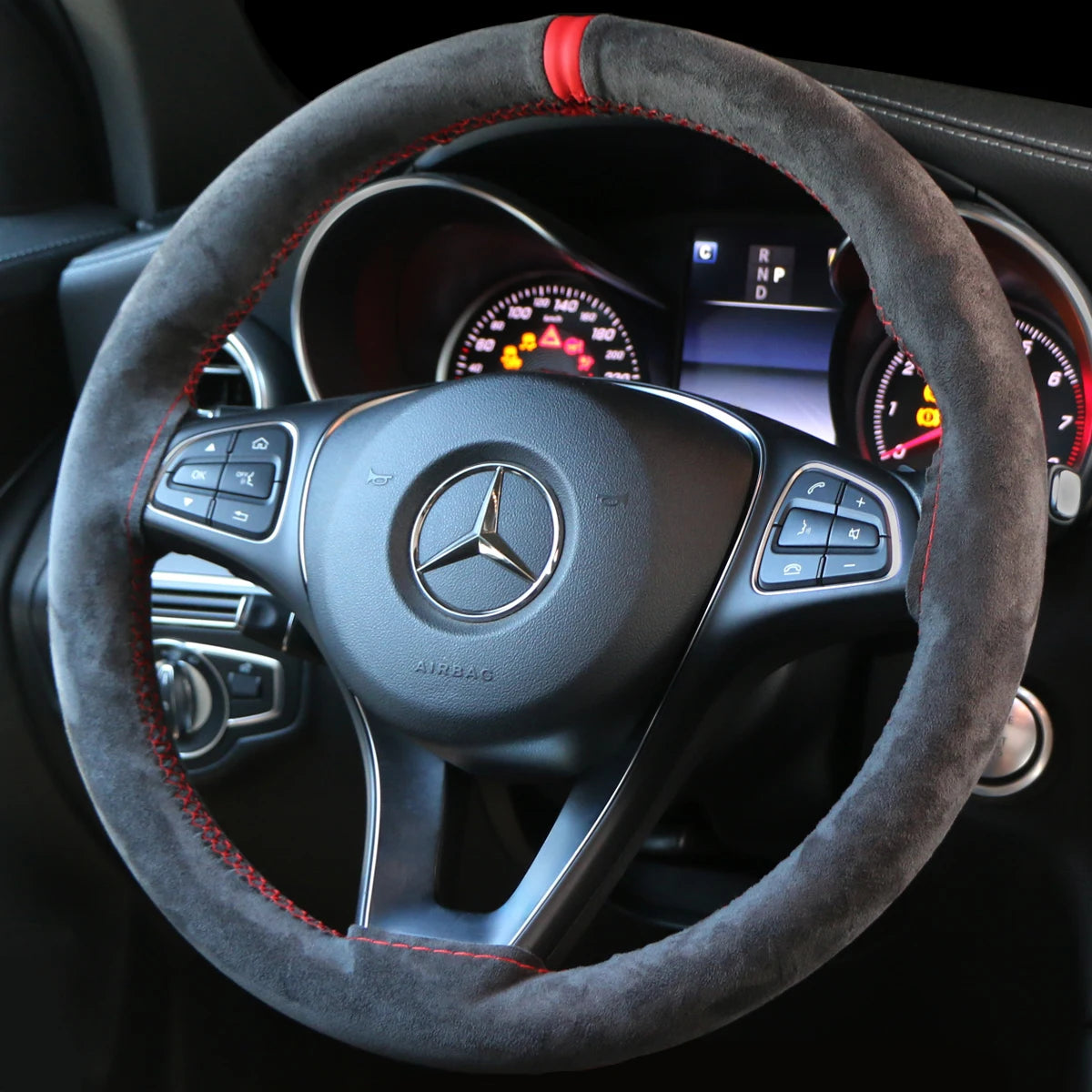 Faux suede steering wheel cover installed in a car