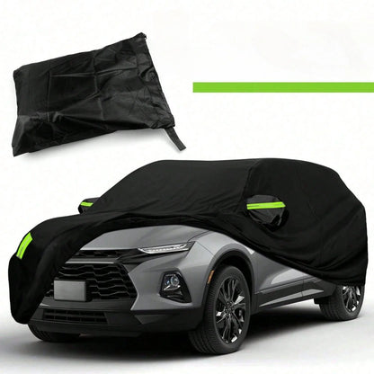 Black outdoor SUV car cover with reflective strips, partly pulled over an SUV