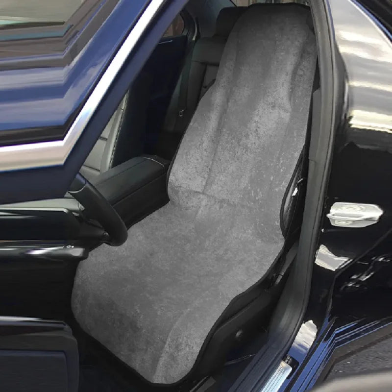 Towel seat cover on a car seat