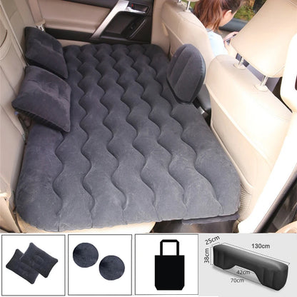 Black air mattress with pillows and accessories