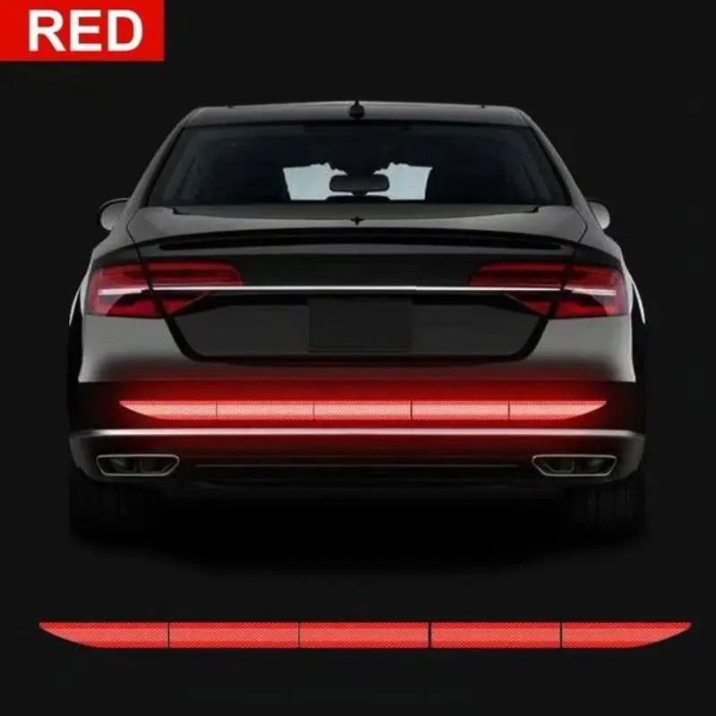 Red reflective strip on the rear bumper of a car