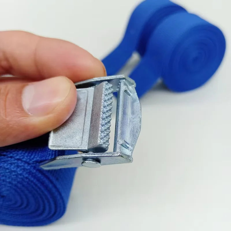 Hand holding a blue strap and its metal buckle