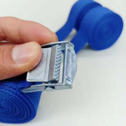 Hand holding a blue strap and its metal buckle