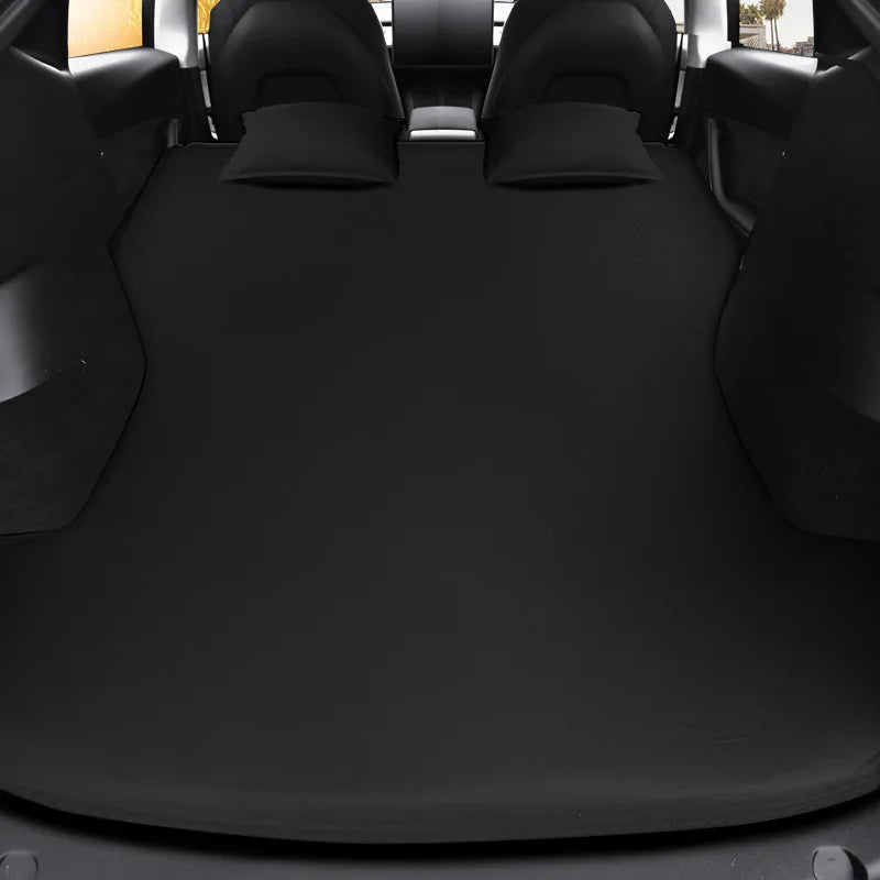 Inflatable air mattress in a Tesla trunk with the rear seats folded