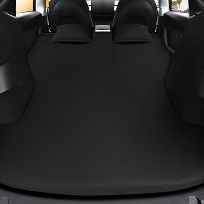 Inflatable air mattress in a Tesla trunk with the rear seats folded