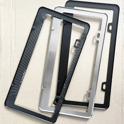 Carbon, black and silver license plate frames