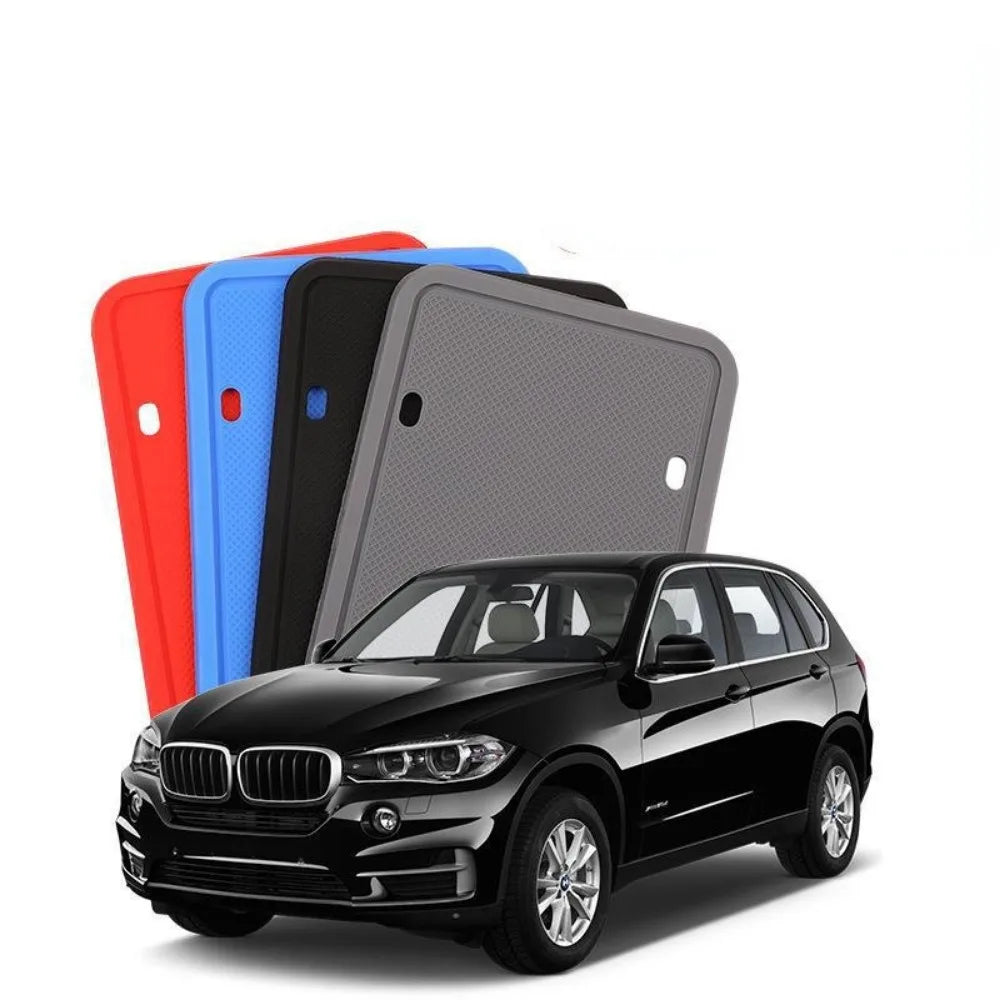 Silicone frames in several colors next to an SUV