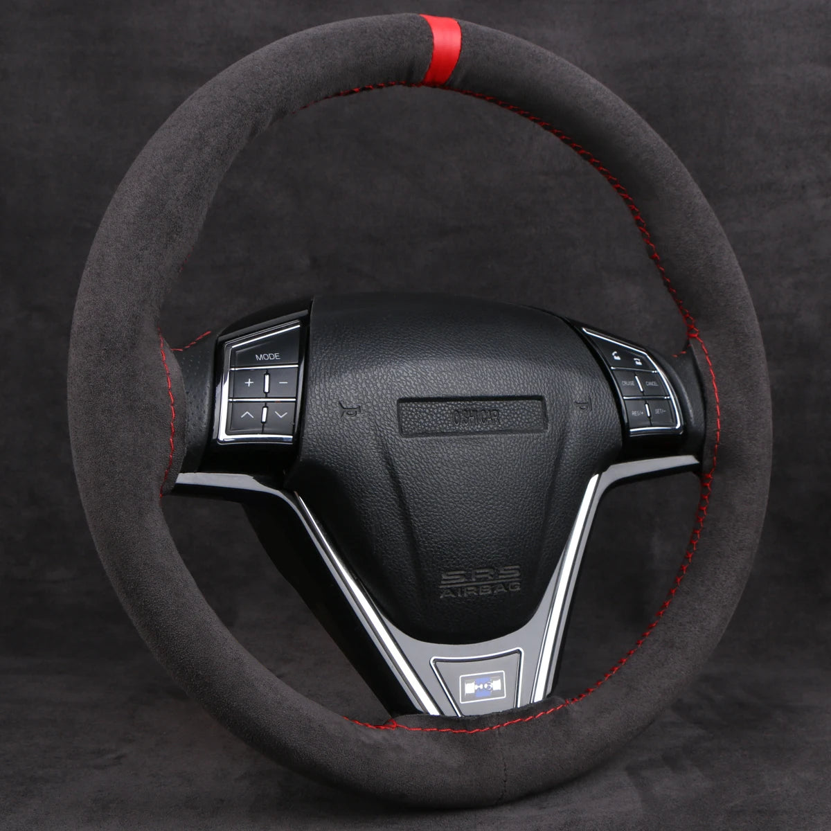 Black faux suede steering wheel cover with a red center stripe on a steering wheel