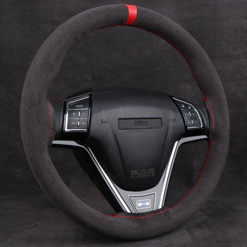 Black faux suede steering wheel cover with a red center stripe on a steering wheel