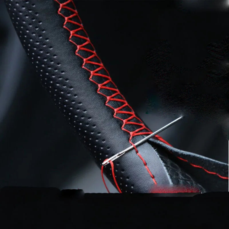Lacing the cover with the needle and red thread
