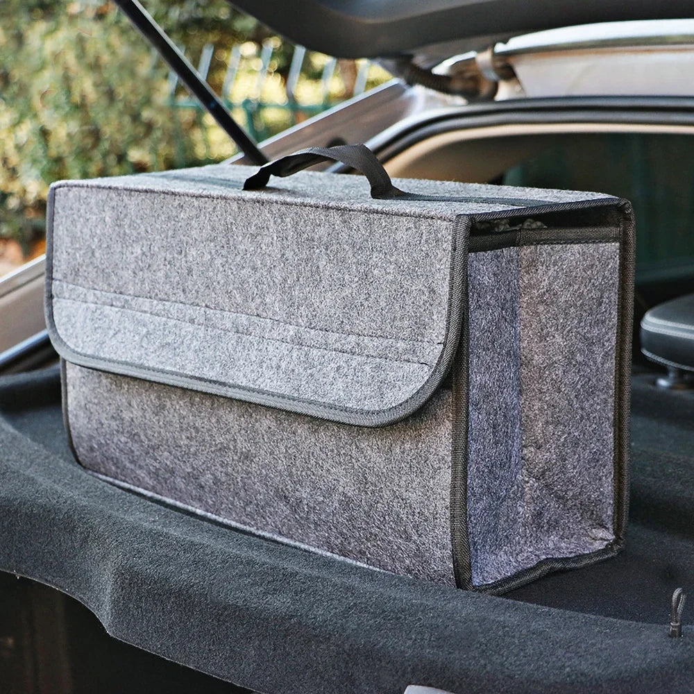 Gray felt trunk organizer with a lid in the trunk