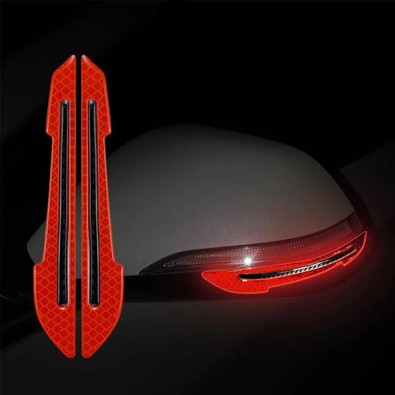 Red reflective strips on a car side mirror